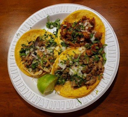 Street tacos. Al pastor at the top, carne asada in the lower right and my favorite Carnitas on the left