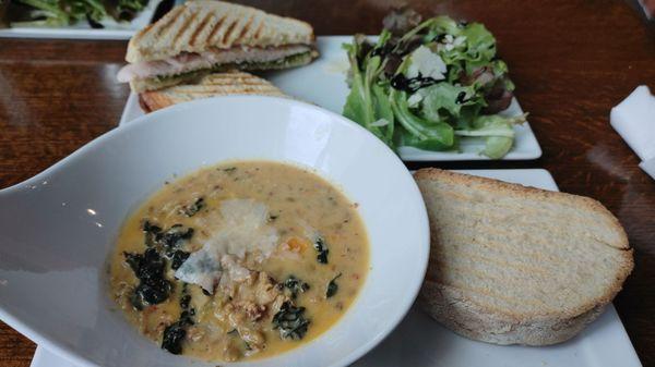 Turkey Panini with Dressed Greens and Roast Sausage with Lentil Soup.