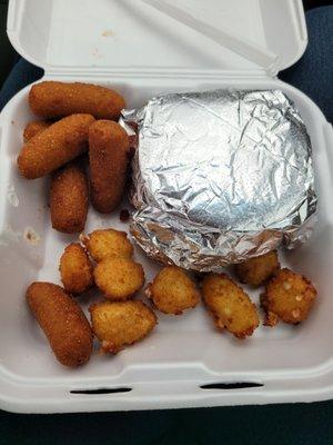 Cajun chicken platter with hush puppies and cheese bites.