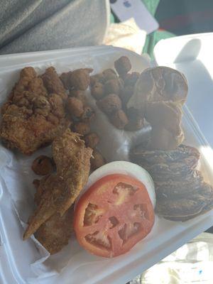 Fried chicken fried okra and fried green tomatoes side of biscuit