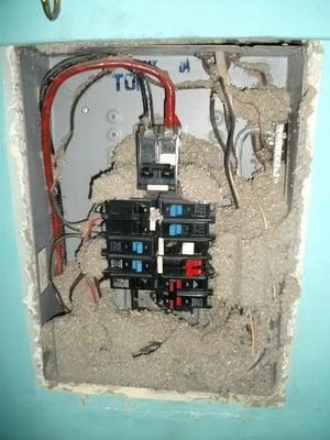 Electric panel filled with blown-in insulation!