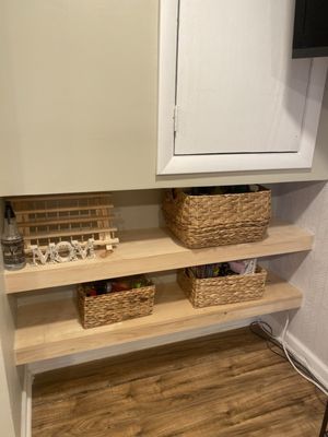 Custom made floating wood shelves by Wilmer! They're stunning !!