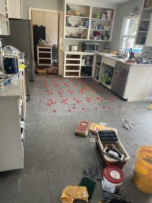 Tile floor installation.
 11-22