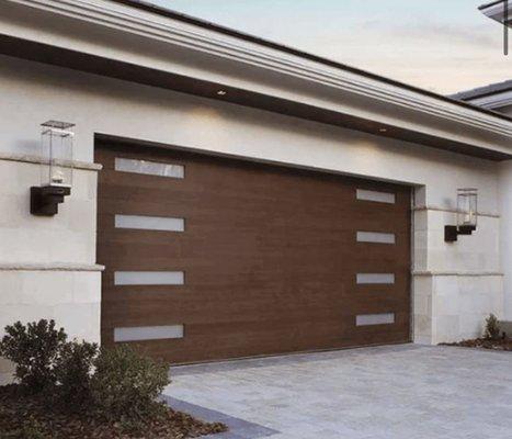 Modern style steel sectional door with "wood" grain finish.