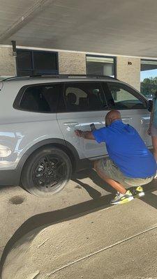 Employee photographing damage