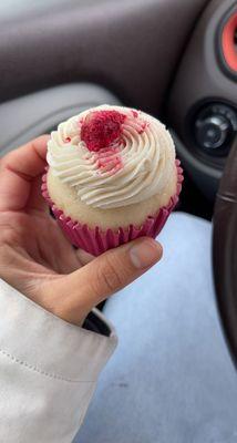 Delicious GF white chocolate raspberry cupcake with a raspberry in the middle!