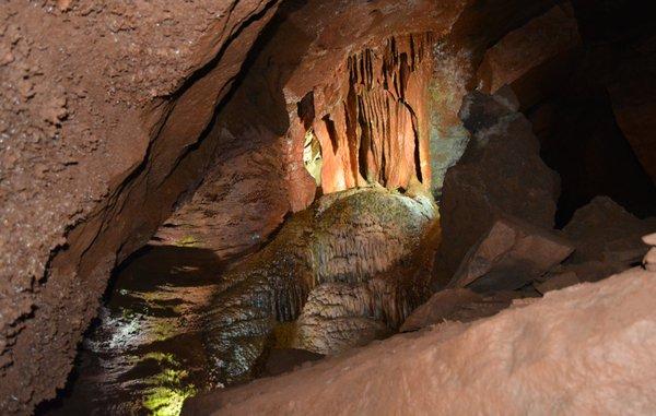 This is called Cave Bacon. "Also called flowstone, cave bacon forms when water smoothly runs down an overhanging wall over and over.