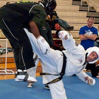 Master Alley fighting in a tournament, throwing a side kick. Awesome kick!