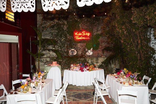 Wedding Reception with multicolored florals at Kim Sing Theatre. Florals by Lovesome Blossoms.