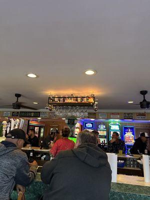 A look towards the bar from the window tables.  You can see some slot machines in the back.