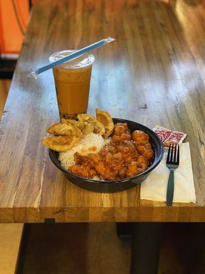 Sweet and Sour Chicken with a Side Order of Gyoza (potsticker) and Thai Iced Tea with Boba