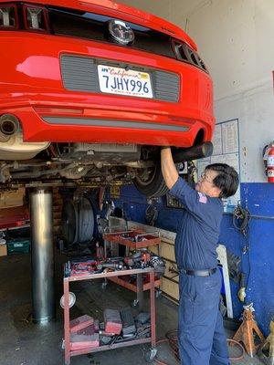 Mr. Long working on the exhaust.