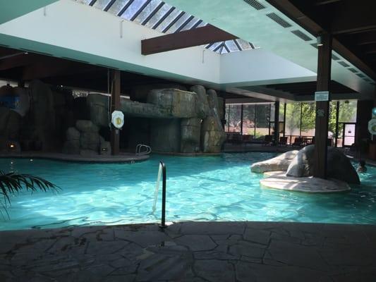 Beautiful indoor pool with a waterfall that comes on every hour.