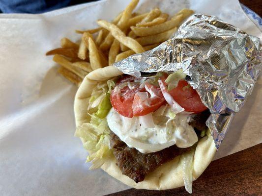 Gyro plate with lamb, shredded lettuce, tomatoes, tziki sauce, on a soft pita and side of fries for only $9.99!