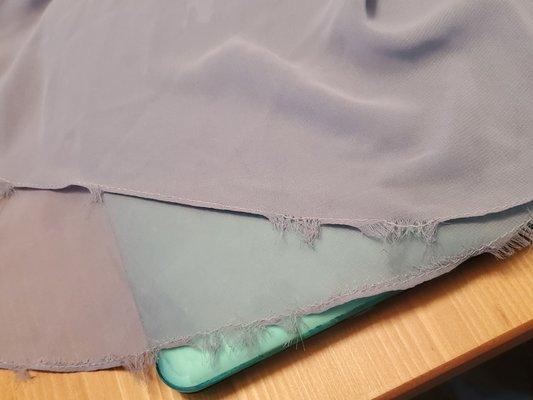 Poor hem and workmanship. Blamed customer and dry cleaner vs owning that they just did not do a good job.