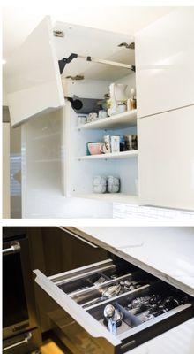 White counter tops,         Material type quartz.               Cabinets with automatic door opener glass finish