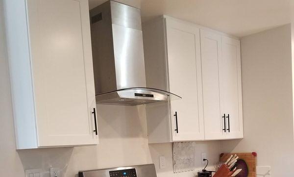 Shaker style white kitchen cabinets.