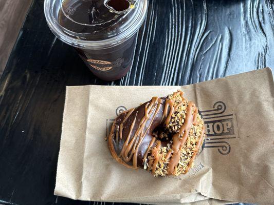 Chai Cold Brew and Chocolate with Nutella drizzle and toasted coconut  donut