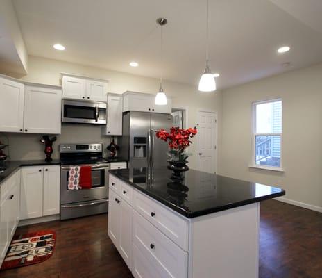 We gave this kitchen an extreme makeover with granite countertops, stainless steel appliances, and beautiful wood floors.