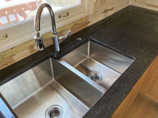 Beautiful commercial grade thick gauge SS undermount sink has held up great after one year so far.