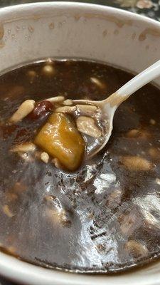 Hot grass jelly soup with peanuts, red bean, and sweet potato+taro balls. One order can feed 2