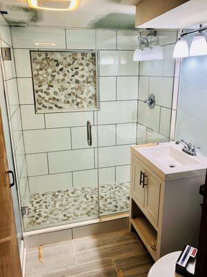 Complete bathroom remodel (tub to shower conversion, floor tile, vanity and light fixture