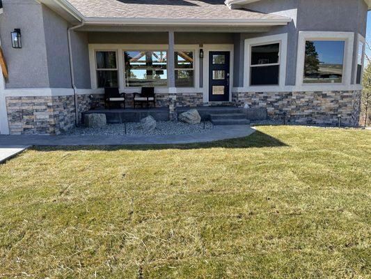 Sod, sprinklers, rock beds and boulders