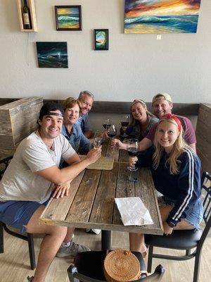 A nice family enjoying a bottle of wine