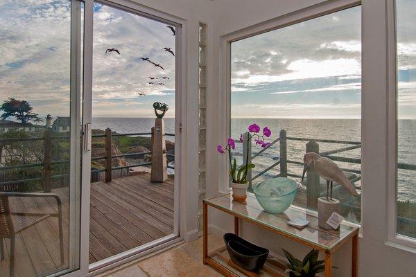 Sunroom view with couch that makes into 4th queen bed