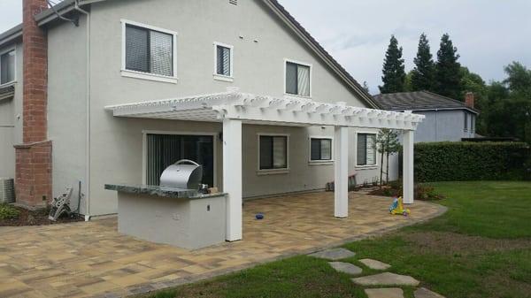 Cal Stone Versailles paver patio, BBQ and painted trellis.