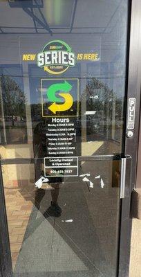 Inaccurate information posted on front door that is inconsistent with the sign on the drive-thru window