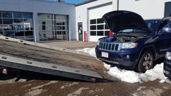 Please notice the service dept right behind the car!