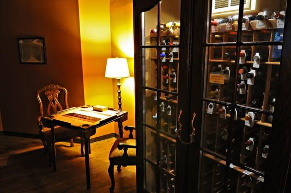 Wine locker and dominoes in the members' lounge.