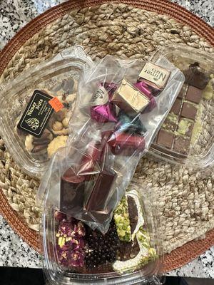 assorted chocolates; cookies with nuts and chocolate; Turkish Delights; "viral pistachio chocolate" bar