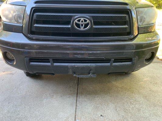 front bumper damaged and license plate tore off