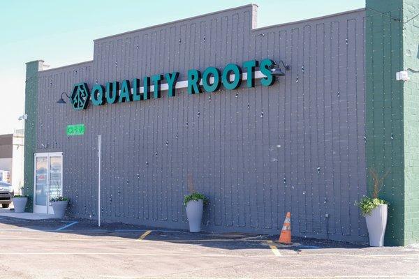 Storefront entrance to Quality Roots Monroe