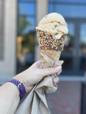 Single scoop butter pecan on ultimate waffle cone