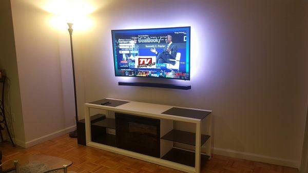 TV & Soundbar installed with wires concealed in wall & remote multi color  led lights on the back.
 Midtown, NYC