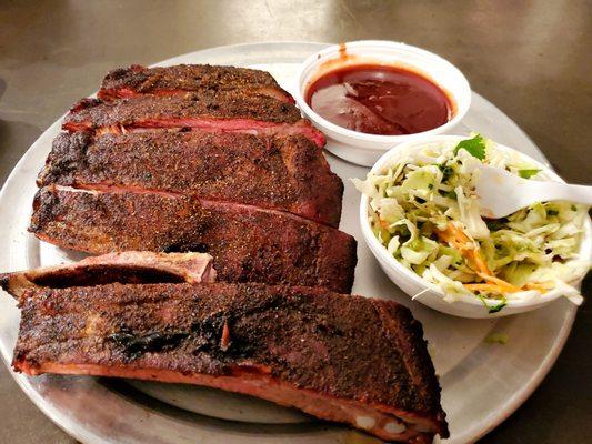 1/2 rack of ribs with sauce on the side and small slaw