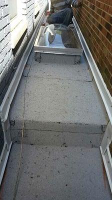 ( After ) New roof , flashings and skylight. New membrane requires no maintenance.