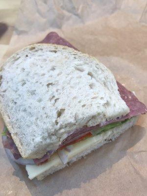 Make your own sandwich (salami and cheese on sourdough bread with lettuce, roasted tomato, and red onion)