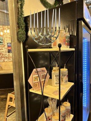 Inclusive owner a Xmas tree & Hanuka menorah.