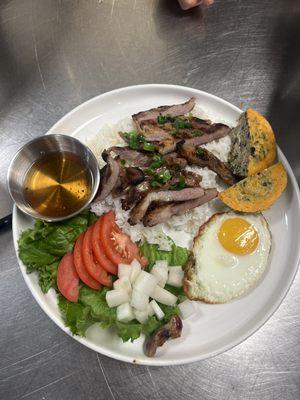 Grill pork rice platter with jasmine rice, crab meat loaf, fried egg and pickle