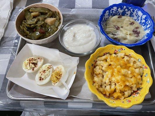 Four item plate: green beans, deviled eggs, Mac & cheese, mashed potatoes with cream cheese (with white gravy)