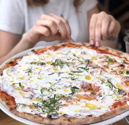 Claudio - Italian tomato sauce, mozzarella, fresh burrata stracciatella cheese, truffle oil and basil.