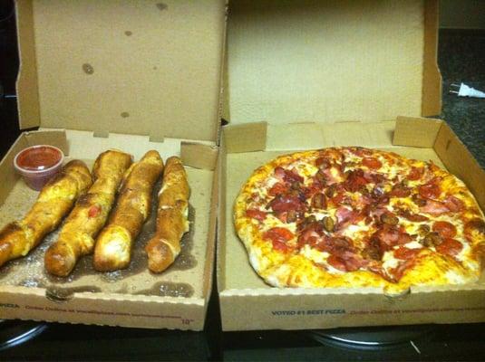 Pepperoni rolls and a meat pizza.