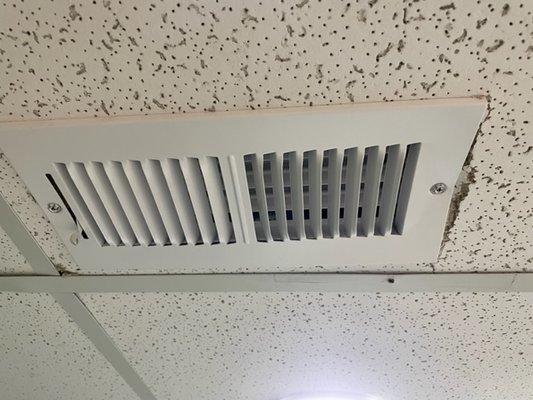 broken ceiling tile with bent registers