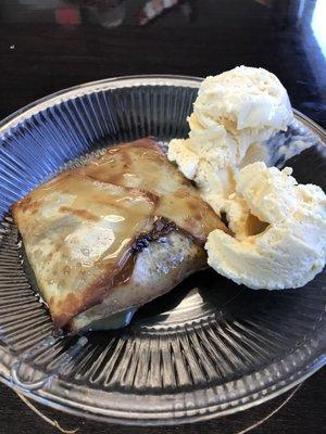 Deep fried dough with apples and ice cream.