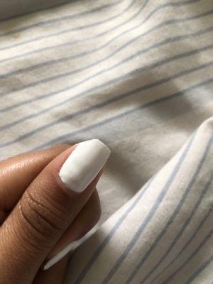 The piece of nail that came off