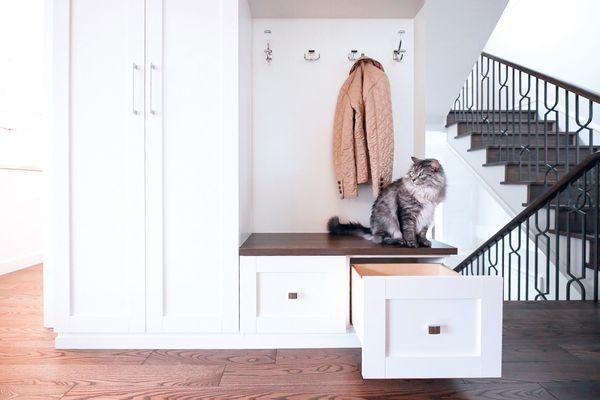 A well-designed entryway doubles as a stylish storage area with multiple organizational options customized to a family's needs.